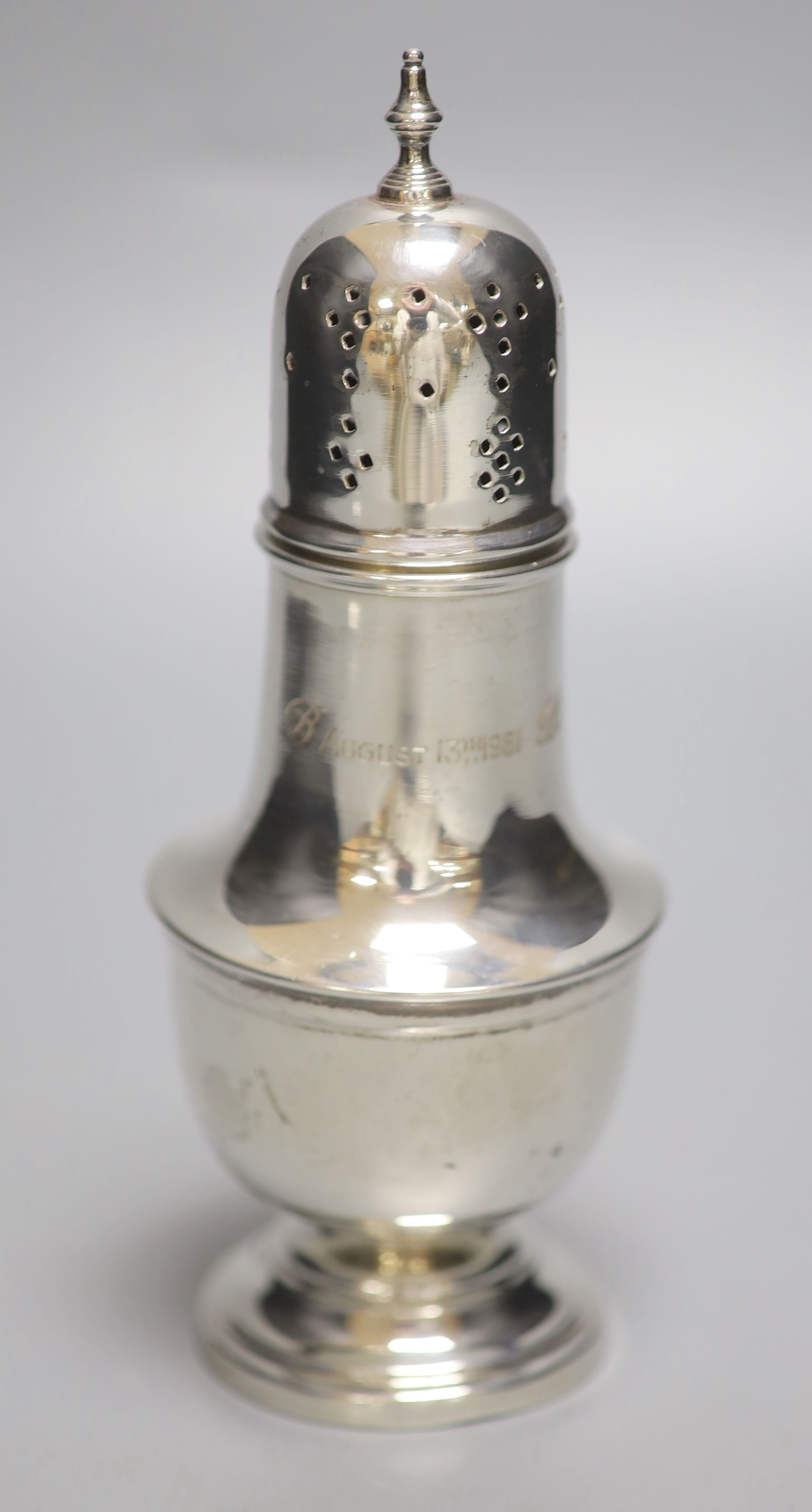 A 1960s silver sugar caster, with engraved inscription, 18cm, 4.5oz (a.f.).